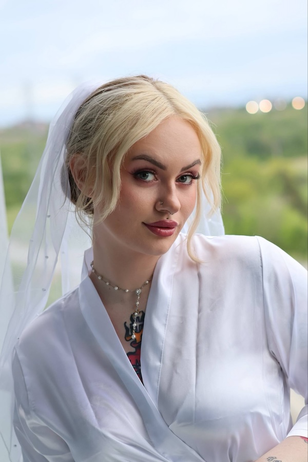 Bridal makeup with smoky eyes and muted rose lipstick