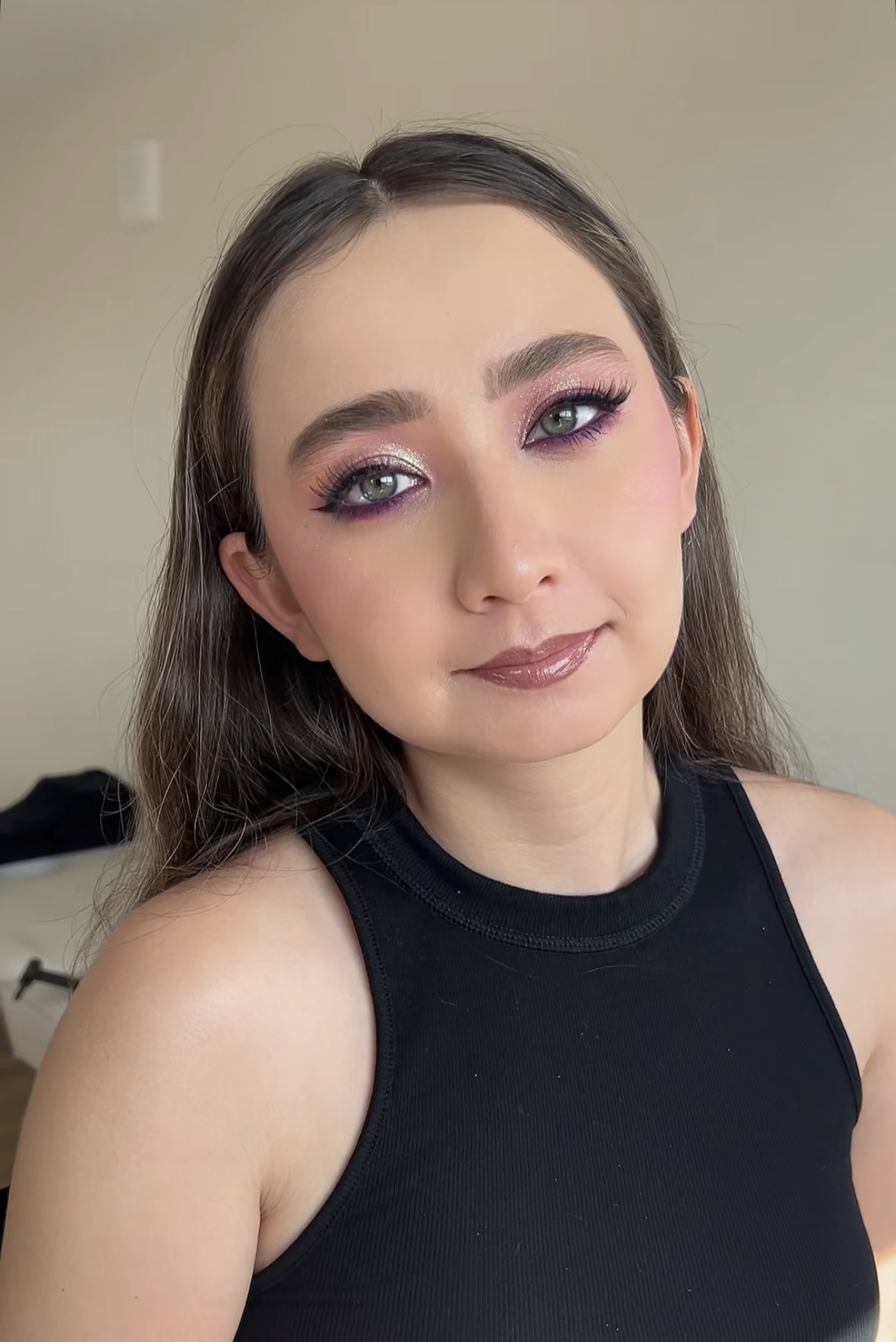 Shimmering pink eye makeup with a glossy pink lip